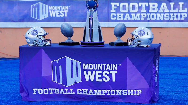 The Mountain West championship trophy, center, awaits the winner of an NCAA college football...