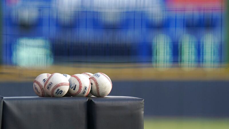 Game balls wait for umpires before the second game of a doubleheader NCAA baseball game...